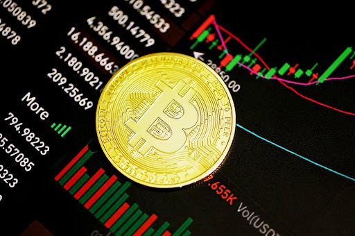 Bitcoin coin on cryptocurrency trading chart showing market volatility and price trends