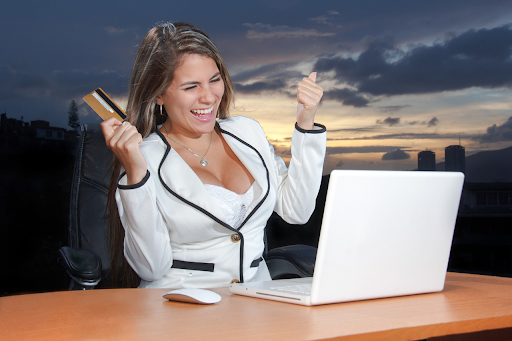 Woman happy making an online purchase with credit card