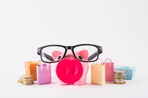 piggy bank in glasses with paper bags
